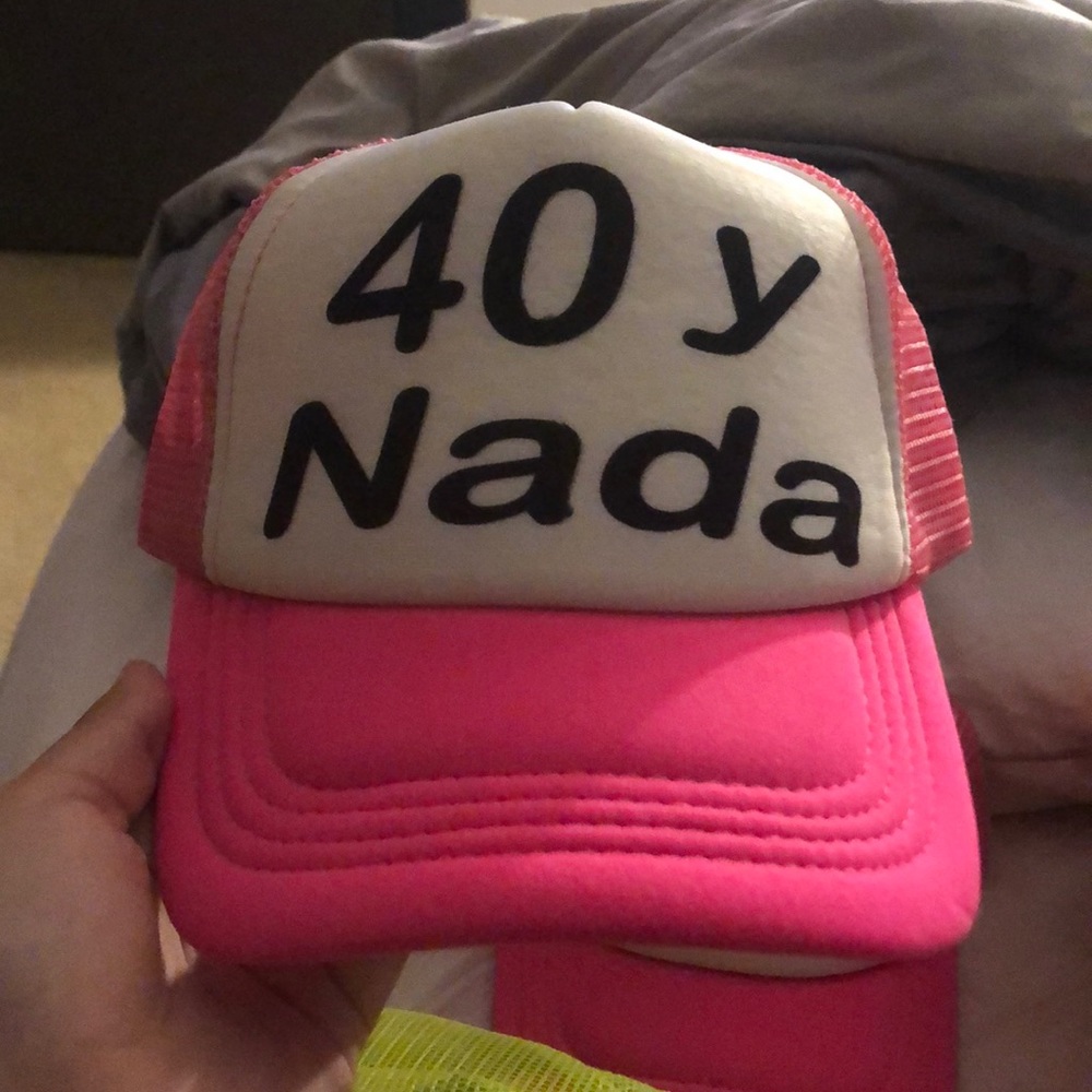 Neon pink hat! “40 y nada” “40 and nothing”
